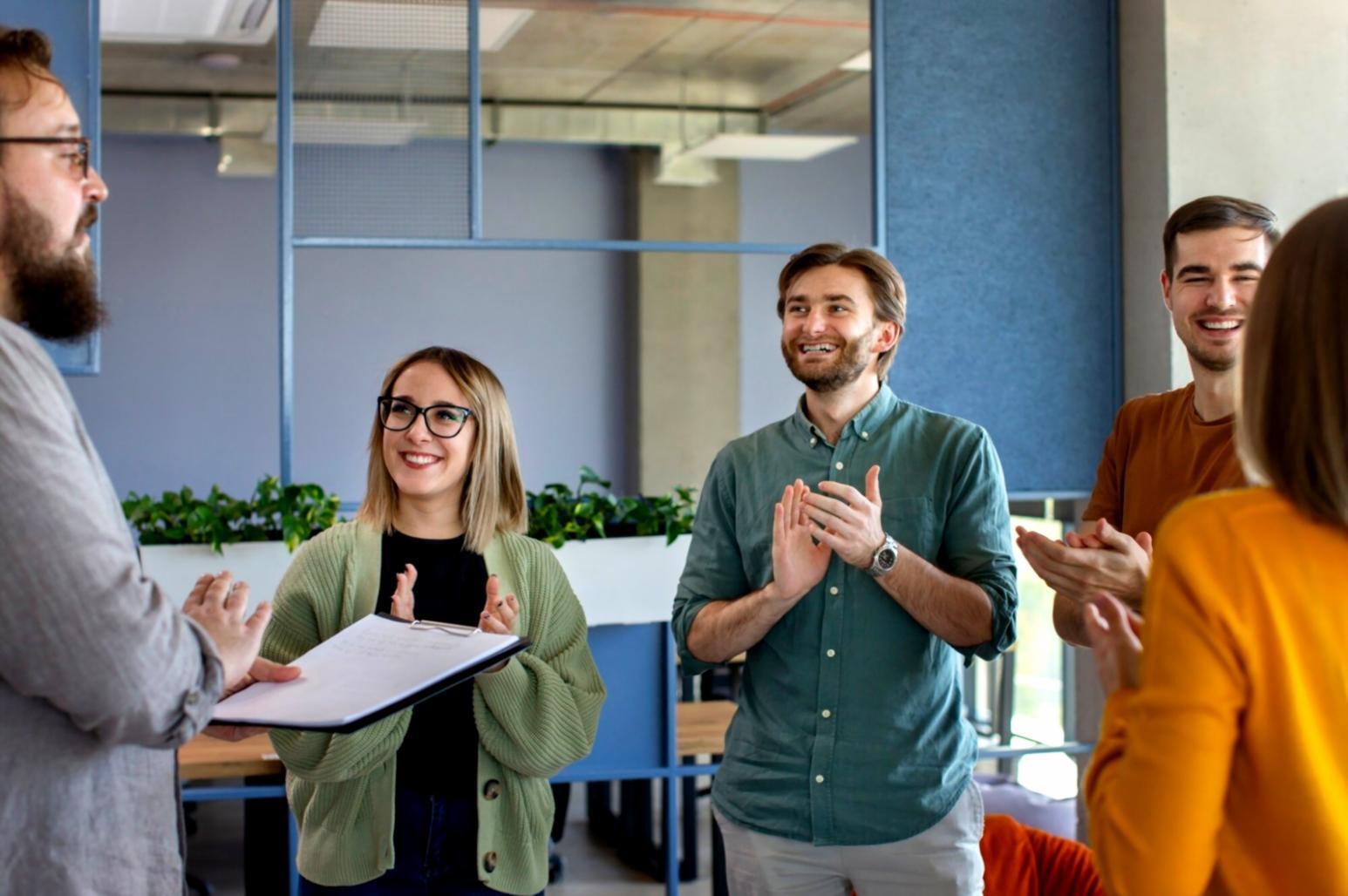 Team collaboration workspace with developers working on mobile applications